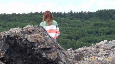 Pretty girl takes a piss while out walking in the country - sexu.com